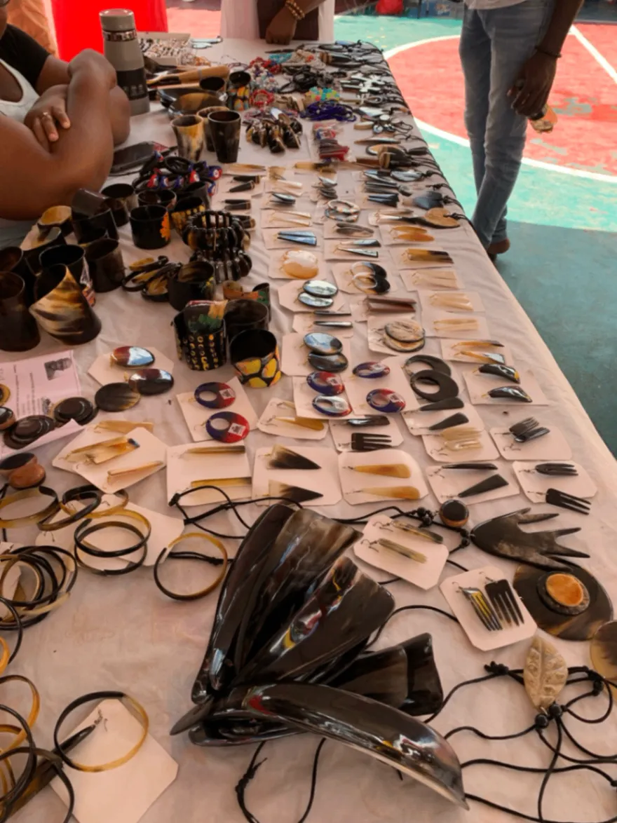 Handmade jewelry and accessories arranged across a market table.